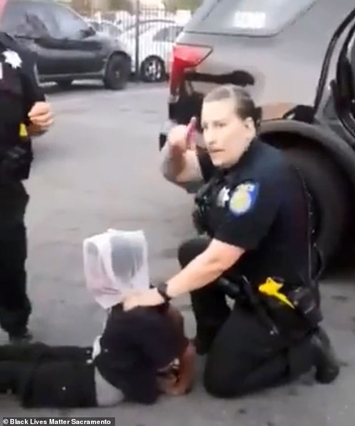 police spit sacramento head bag over mask officers face putting boy arrest during incident filed angry bystanders happened viral released